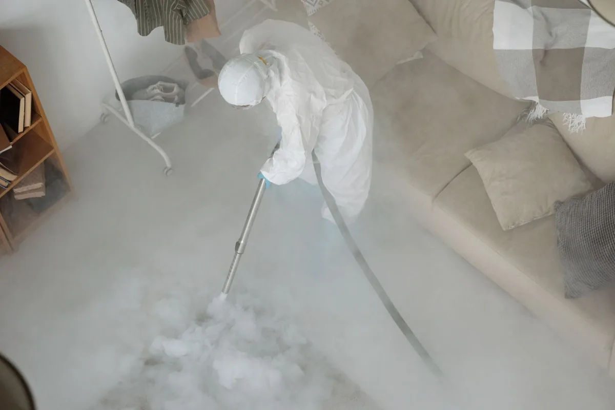 Biohazard cleanup technician in protective equipment, Orange, CA